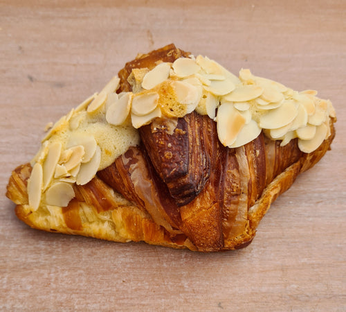 Traditional French almond croissant with frangipane and flaked almonds – handmade pastry in Brisbane and Gold Coast bakery