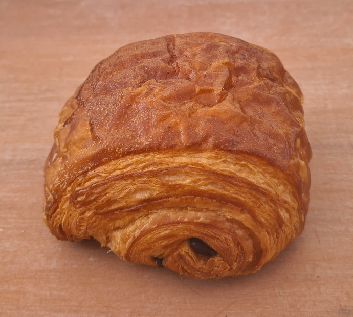 Golden French pain au chocolat with two dark chocolate bars – handmade pastry in Brisbane and Gold Coast bakery